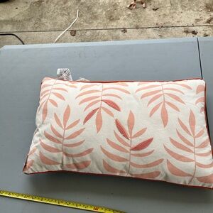 Leaf Patterned Pillow with orange Accents